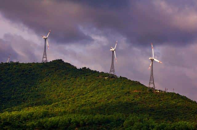 Wind turbines on a green hill